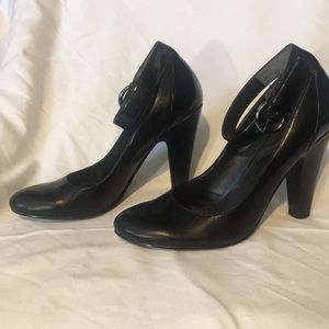 Black heels w ankle strap, metallic silver buckle